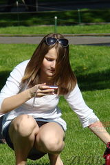Squatting chick. Candid upskirts in the park